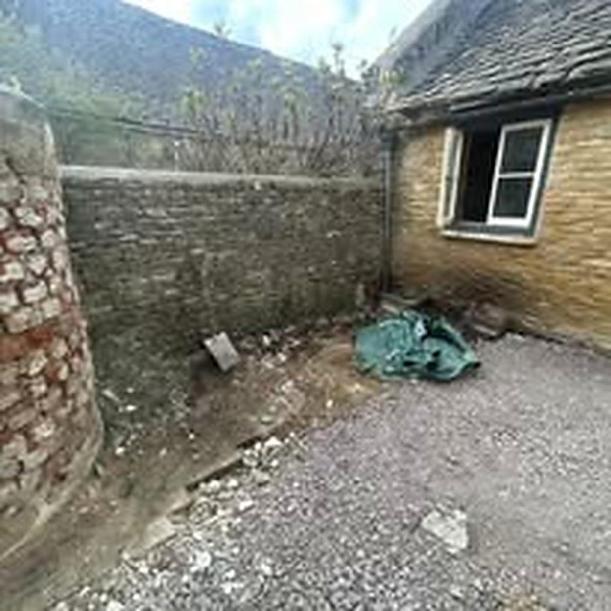 The same courtyard swept clear of rubble after removal