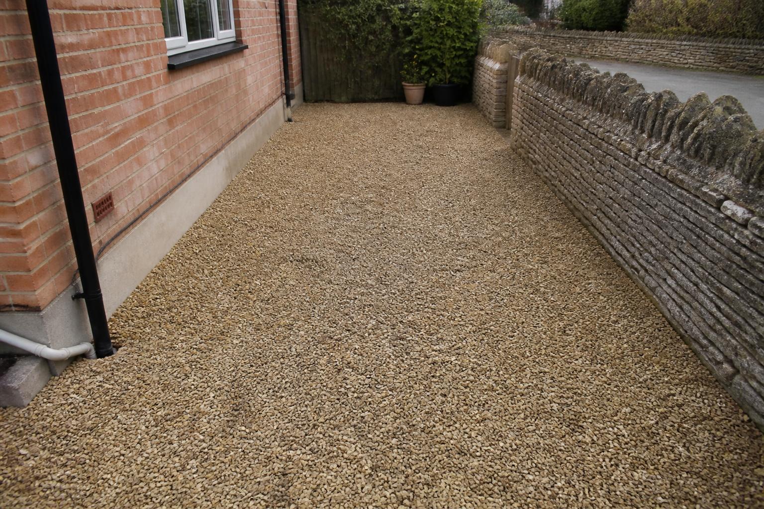 Gravel side yard swept clear after builders waste removal
