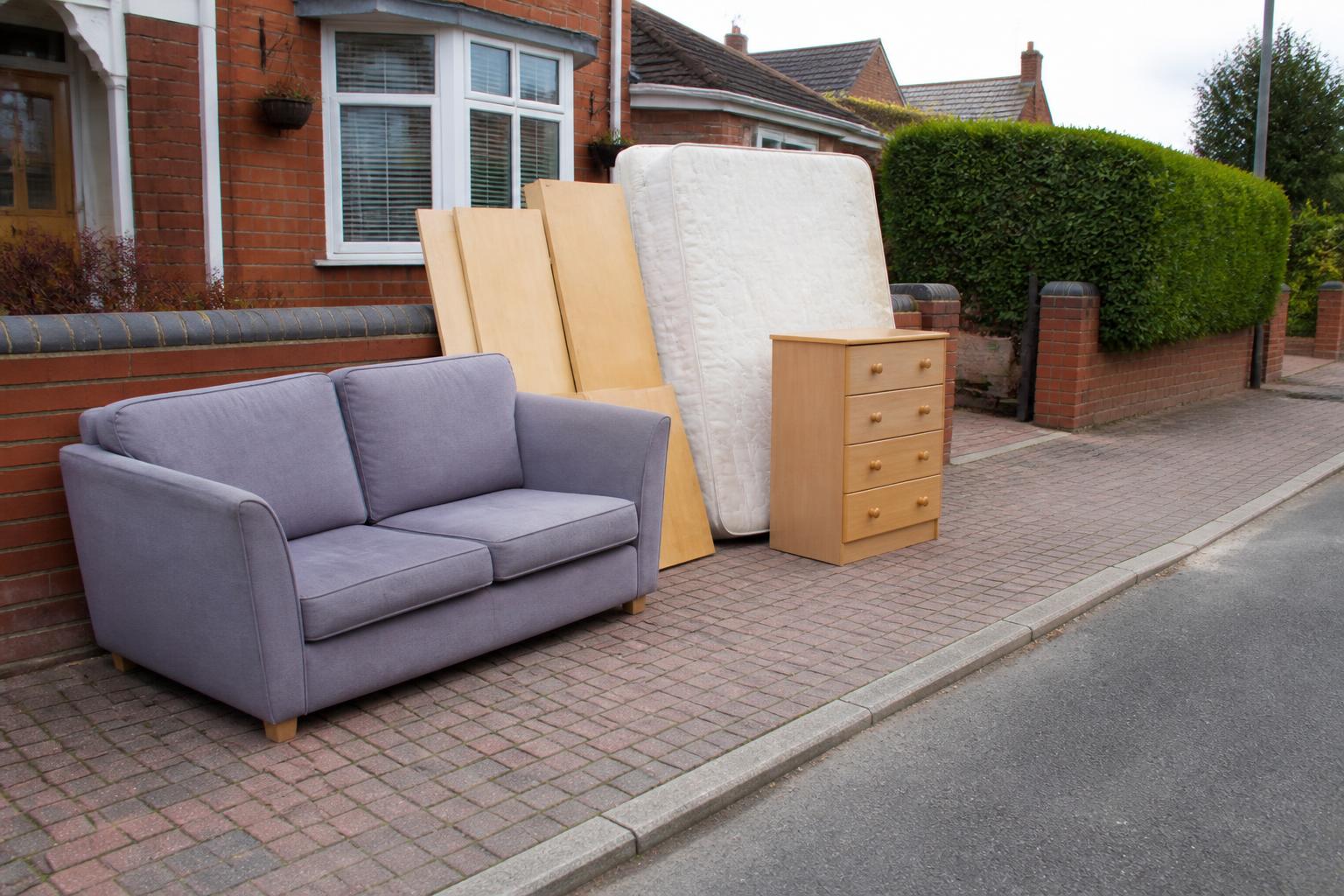 Sofa, mattress and dismantled furniture ready for bulky item collection