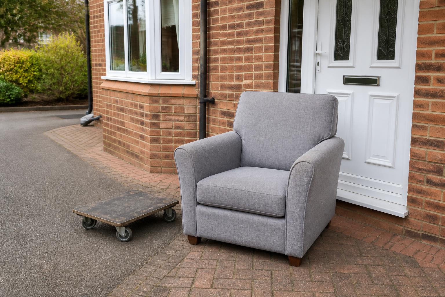 Single armchair ready for collection outside a house